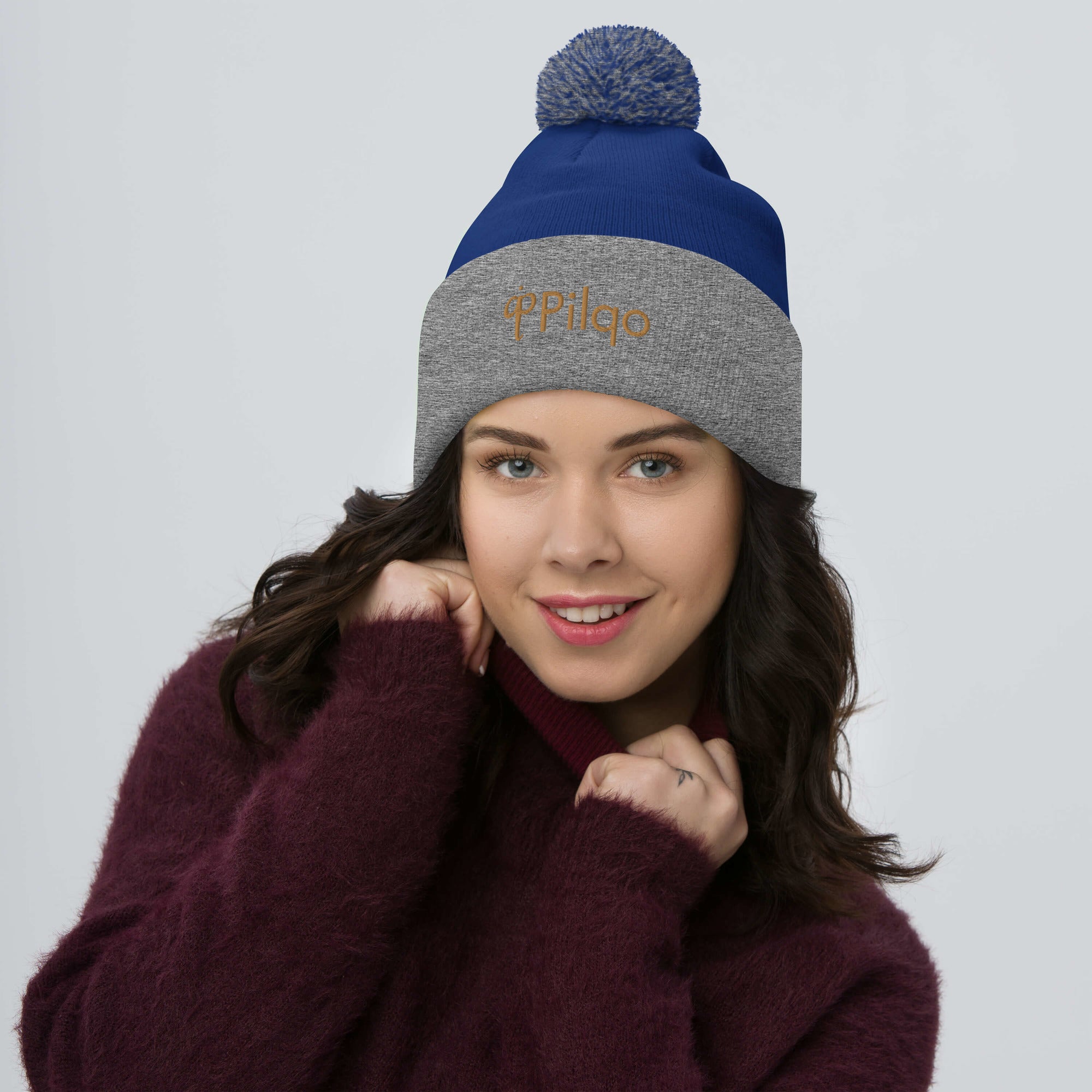 Pom-Pom Beanie with old gold logo