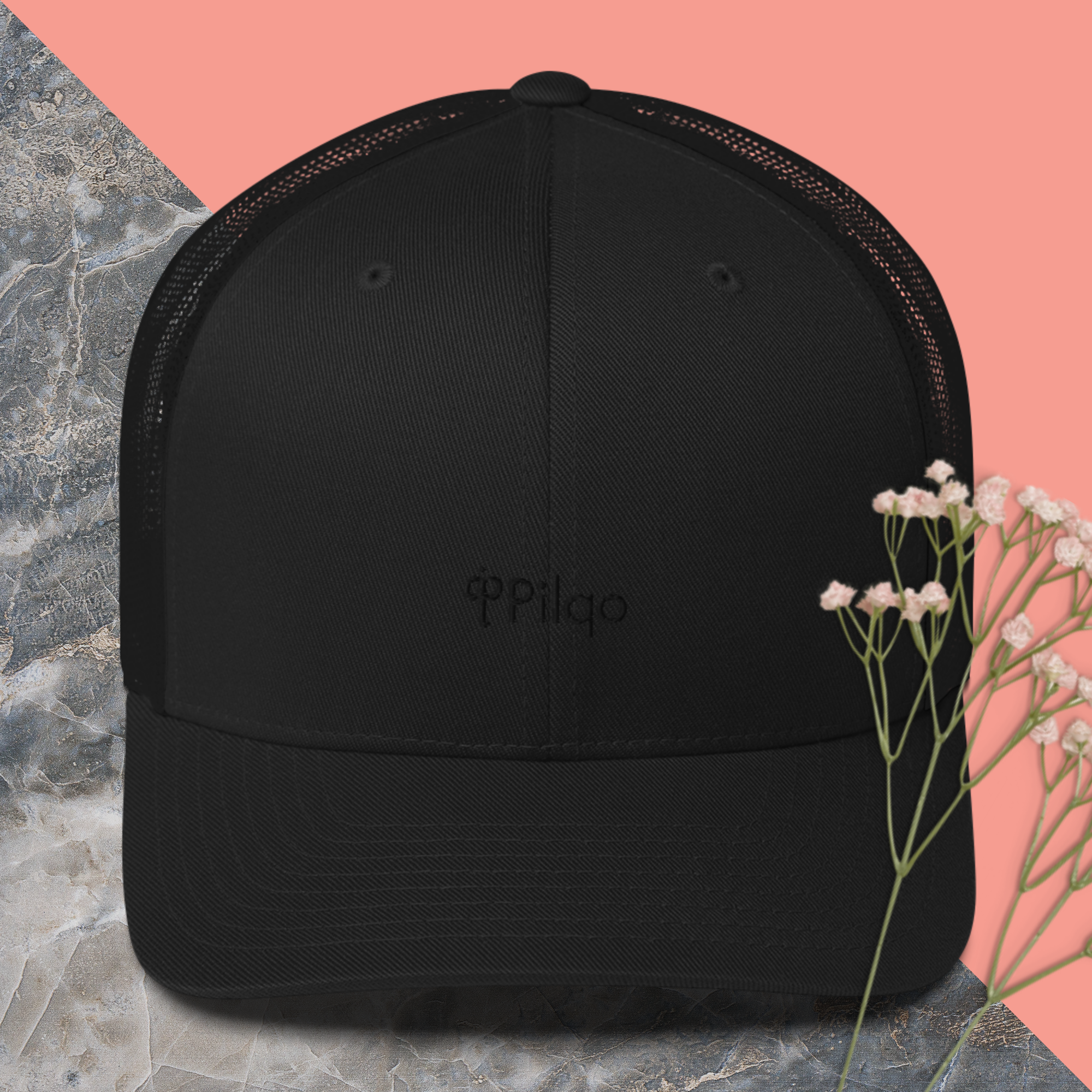 Trucker cap with a black logo