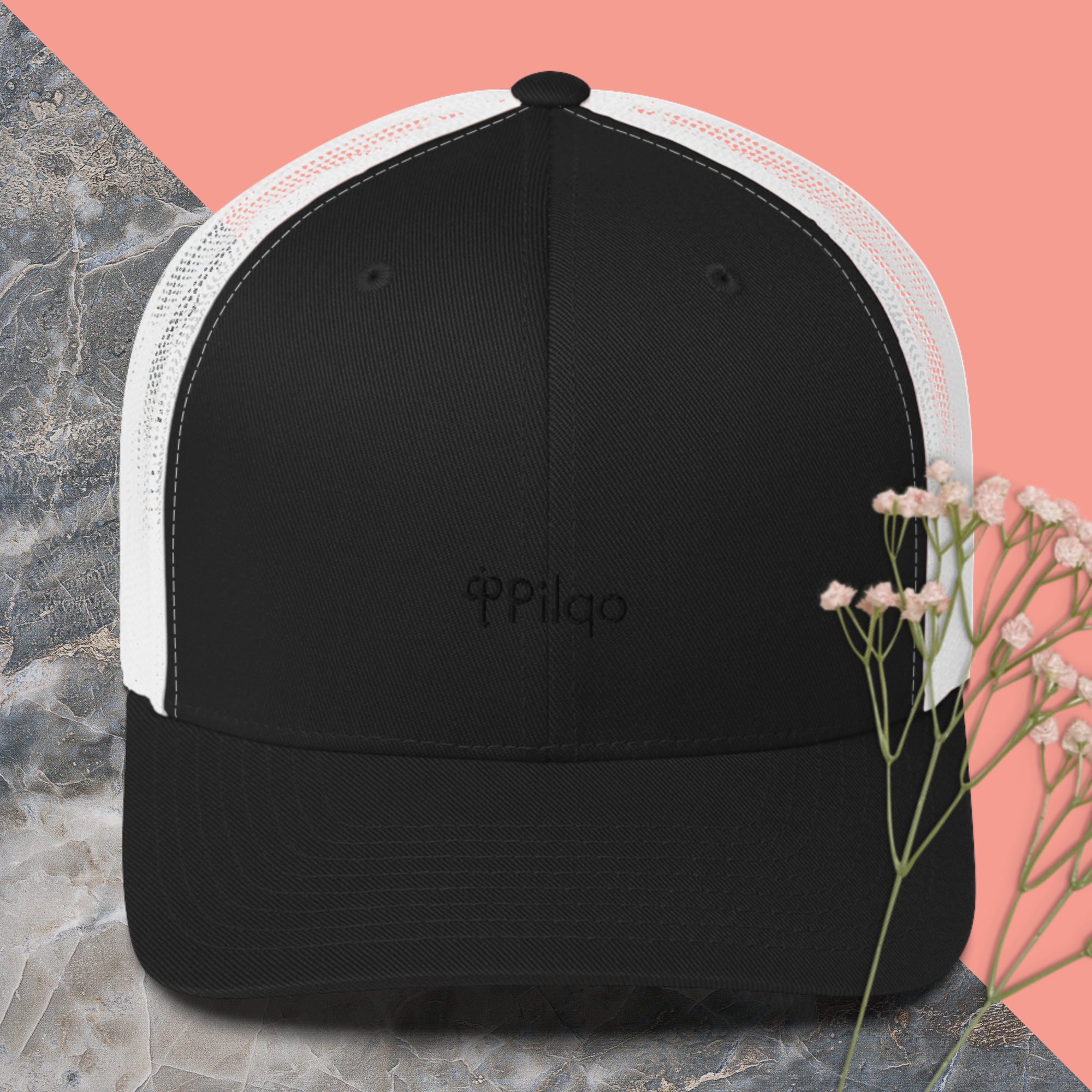 Trucker cap with a black logo